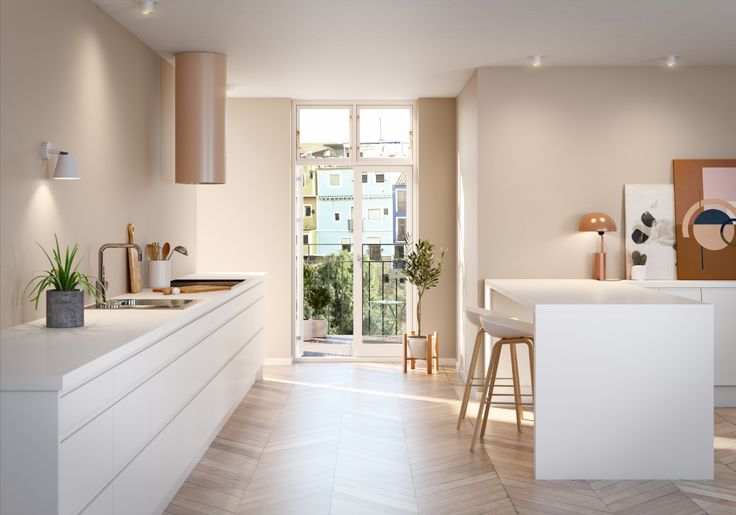 Et illustrasjonsbilde av en hvitt kjøkken med detaljer i rosegull. Kjøkkenet har lyse rosa vegger og man ser videre ut i leiligheten mot stue og balkong.